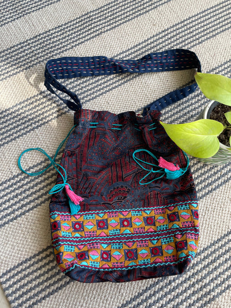 Ajrakh blockprinted Mashru Silk Embroidered Potli Style Bag