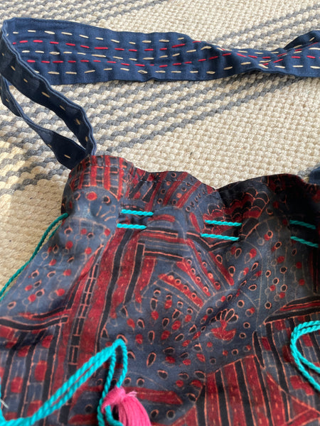 Ajrakh blockprinted Mashru Silk Embroidered Potli Style Bag