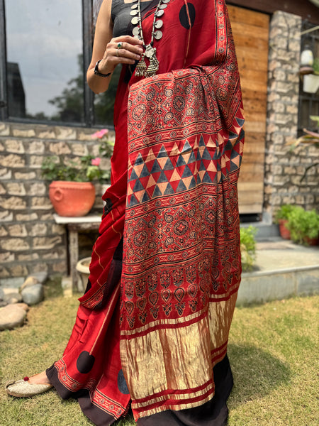 Ajrakh naturally dyed modal silk saree with zari border pallu