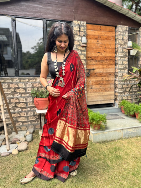 Ajrakh naturally dyed modal silk saree with zari border pallu