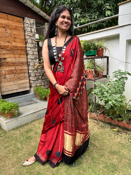 Ajrakh naturally dyed modal silk saree with zari border pallu