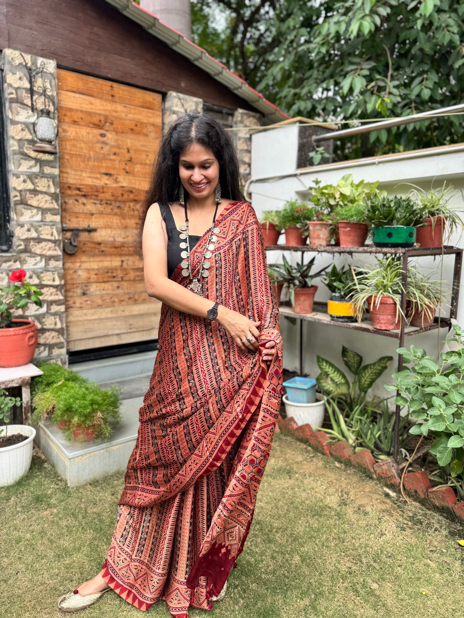 Ajrakh naturally dyed modal silk saree with embroidered pallu