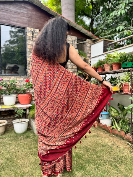 Ajrakh naturally dyed modal silk saree with embroidered pallu