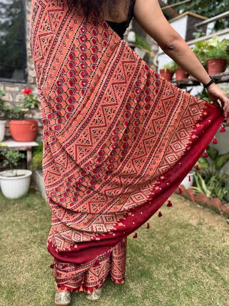Ajrakh naturally dyed modal silk saree with embroidered pallu
