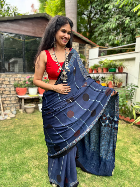 Ajrakh naturally dyed modal silk saree with zari border pallu