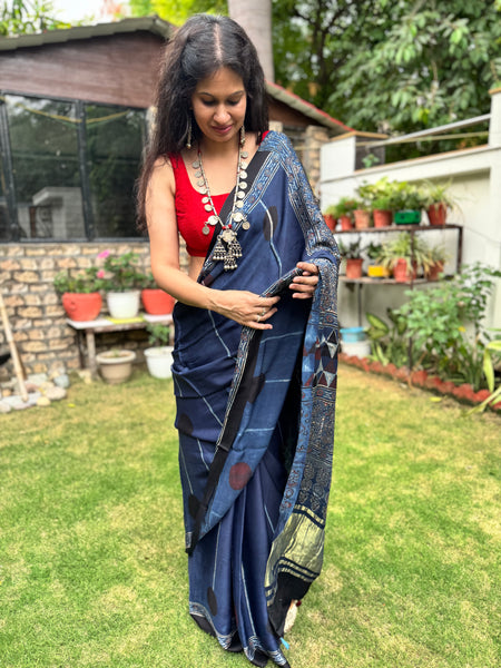 Ajrakh naturally dyed modal silk saree with zari border pallu