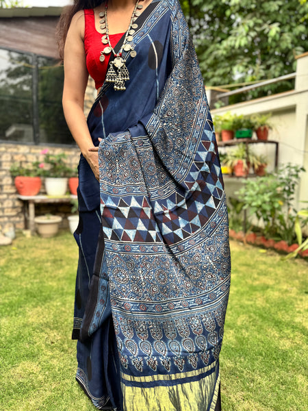 Ajrakh naturally dyed modal silk saree with zari border pallu