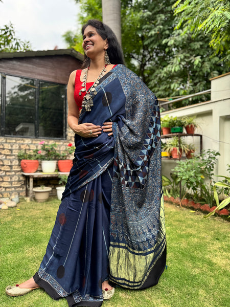 Ajrakh naturally dyed modal silk saree with zari border pallu